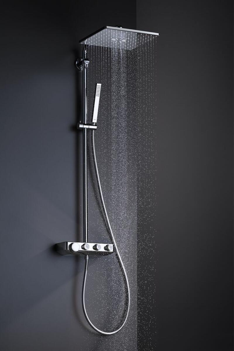 This may contain: a shower head with thermostaer attached to it