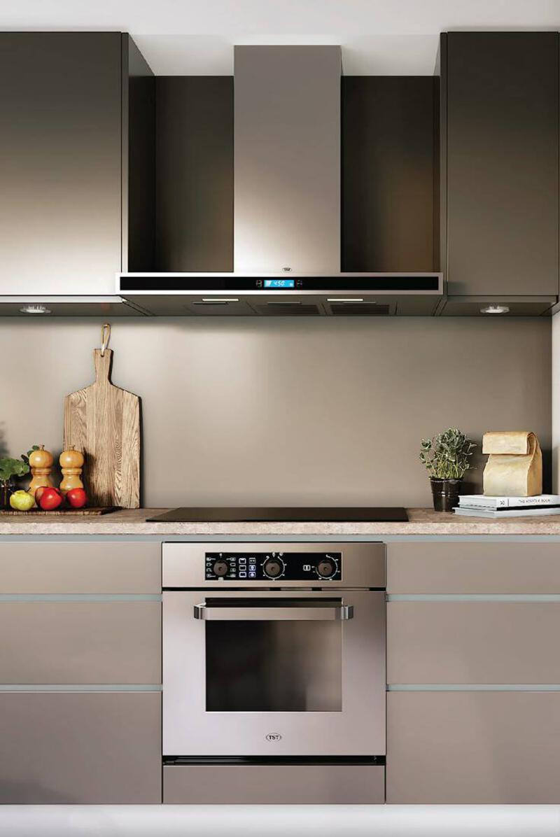 This may contain: a modern kitchen with stainless steel appliances and counter tops