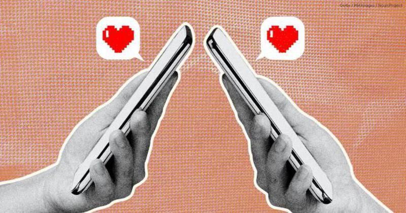 This may contain: two hands holding smart phones with hearts on them, and the other hand is holding a cell phone