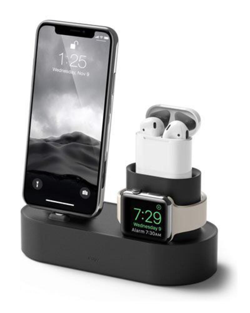 This may contain: an apple watch and earphones are on a charging station