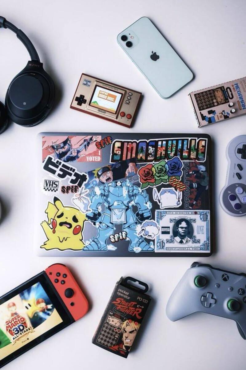 This may contain: nintendo wii game console, headphones, and other items laid out on a table