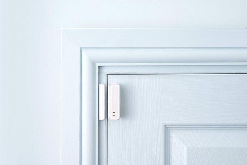 This may contain: an electronic door lock on a white door