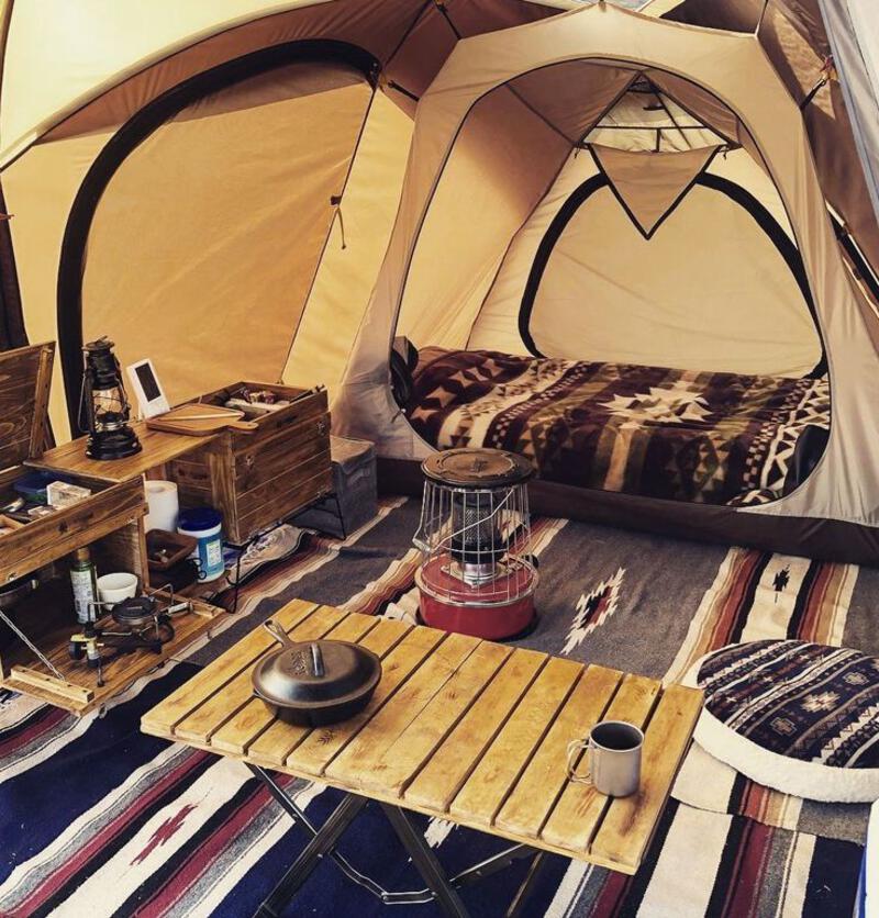 This may contain: the inside of a tent that is set up for camping