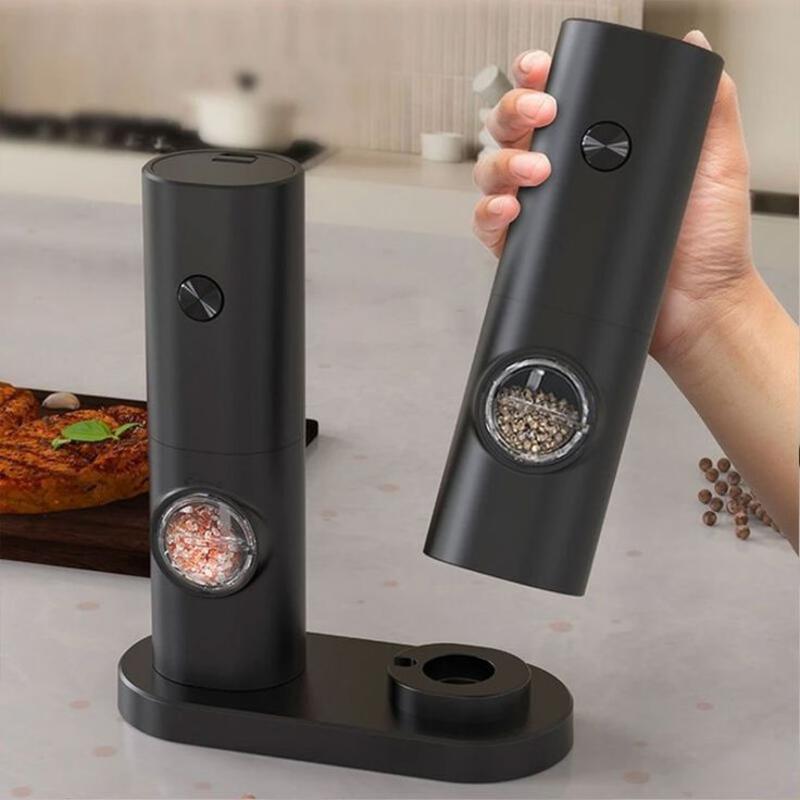 This may contain: a person holding an electronic device in front of a pizza on a table with other items