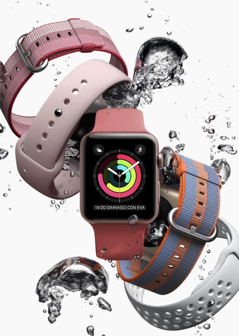 This may contain: an apple watch with water splashing around it