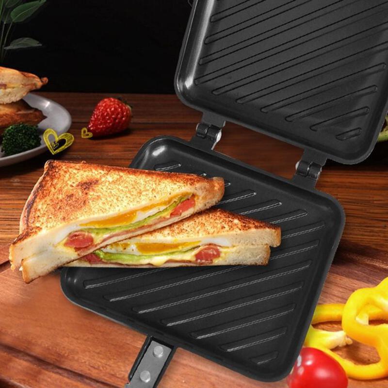 This may contain: a grilled sandwich sitting on top of a panini maker