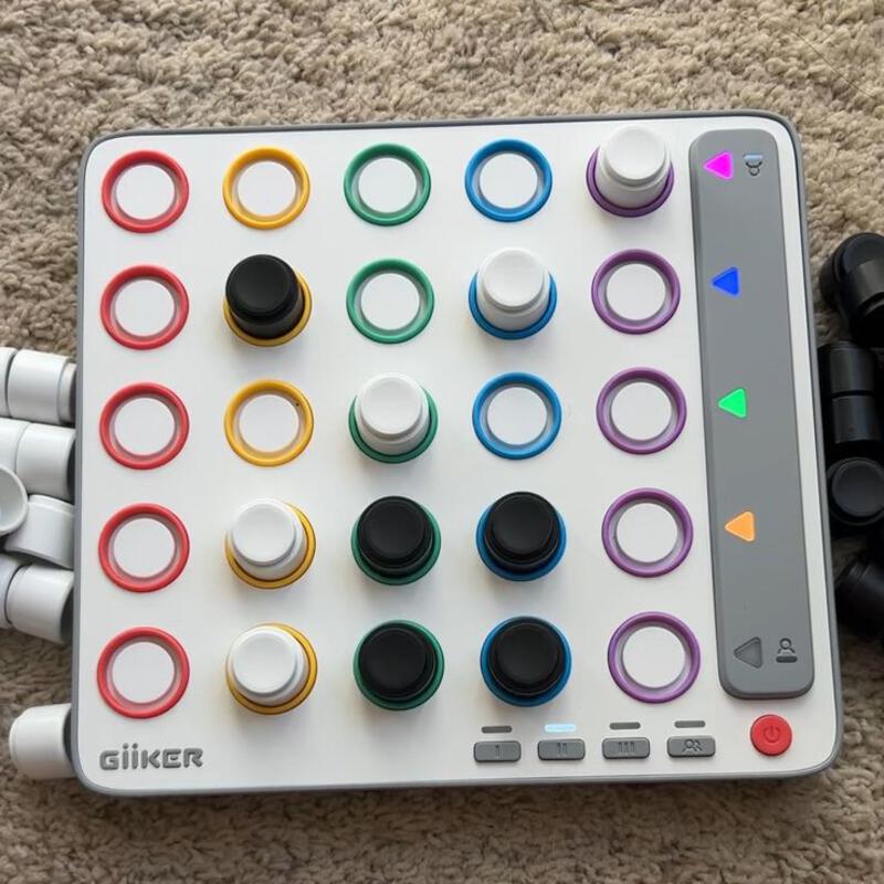 This may contain: an electronic device with many different colored buttons