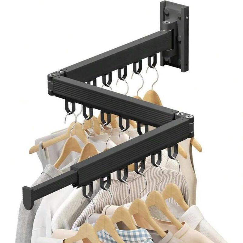 This may contain: three racks with clothes hanging on them and one rack holding two pairs of shirts, the other