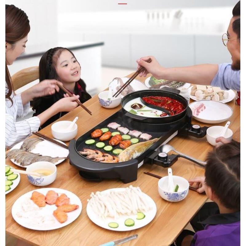 This may contain: people sitting around a table with food and chopsticks