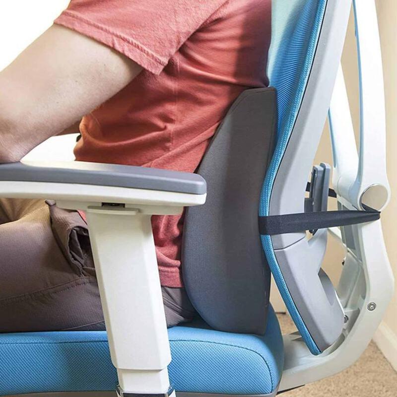 This may contain: a person sitting in a chair with their foot on the arm rest and one hand on the back of the chair