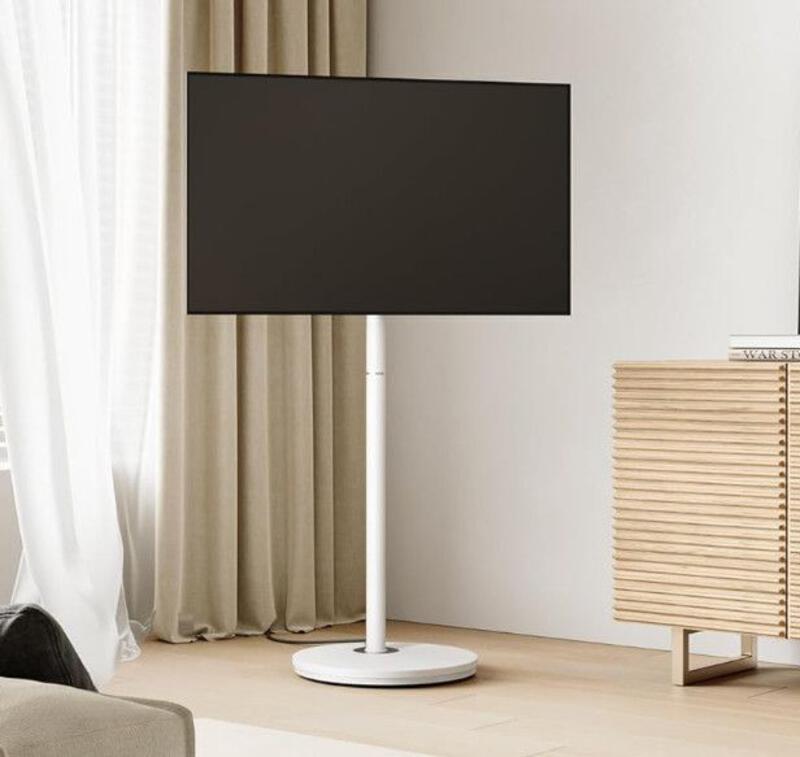 This may contain: a flat screen tv sitting on top of a wooden stand