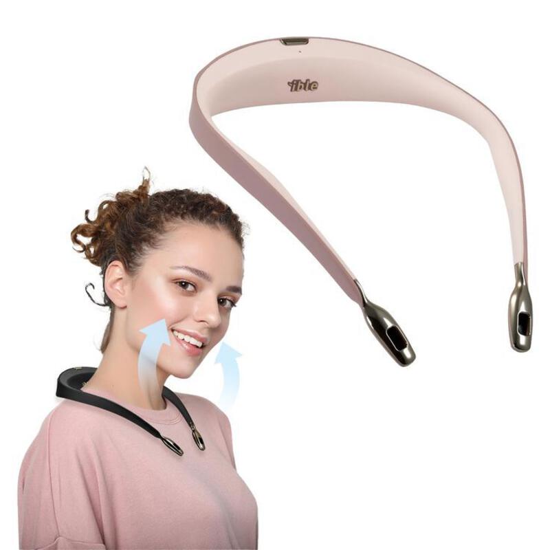This may contain: a woman is smiling with her hair tied back to the side, and an electric device attached to her head