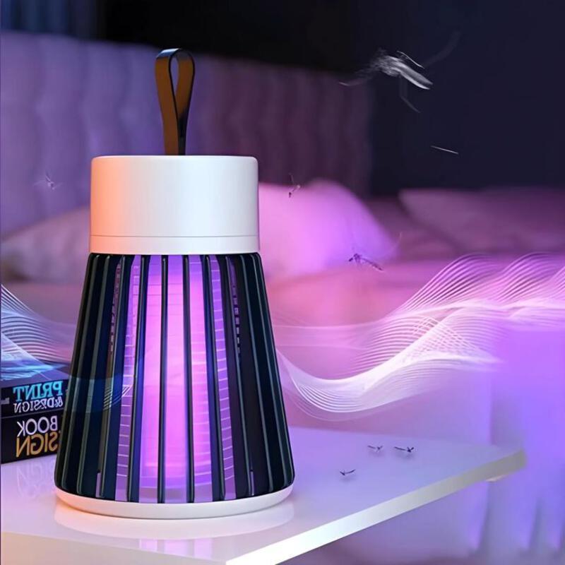 This may contain: a purple and white lamp sitting on top of a table next to a book shelf