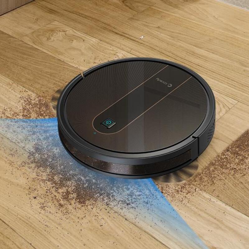 This may contain: a robotic vacuum cleaning the floor with dirt on it