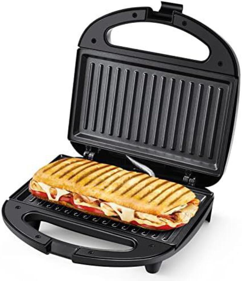 This may contain: a sandwich is being grilled on an electric griddle with the lid open to show it