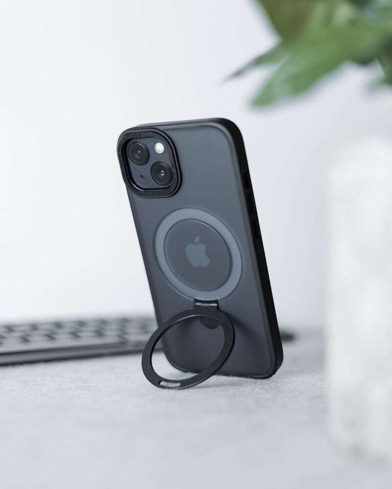 This may contain: an iphone is plugged in to a charging station with a ring on the back