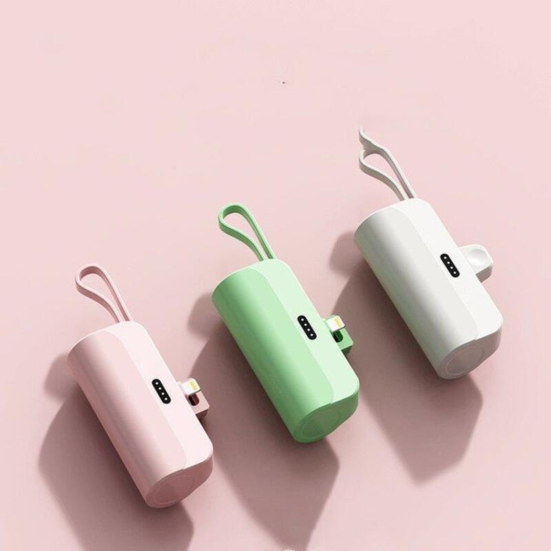 This may contain: three different types of electrical devices on a pink and green background, one with an external charger