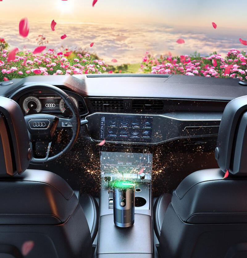 This may contain: the interior of a car with pink flowers in the background and an electronic device on the dashboard