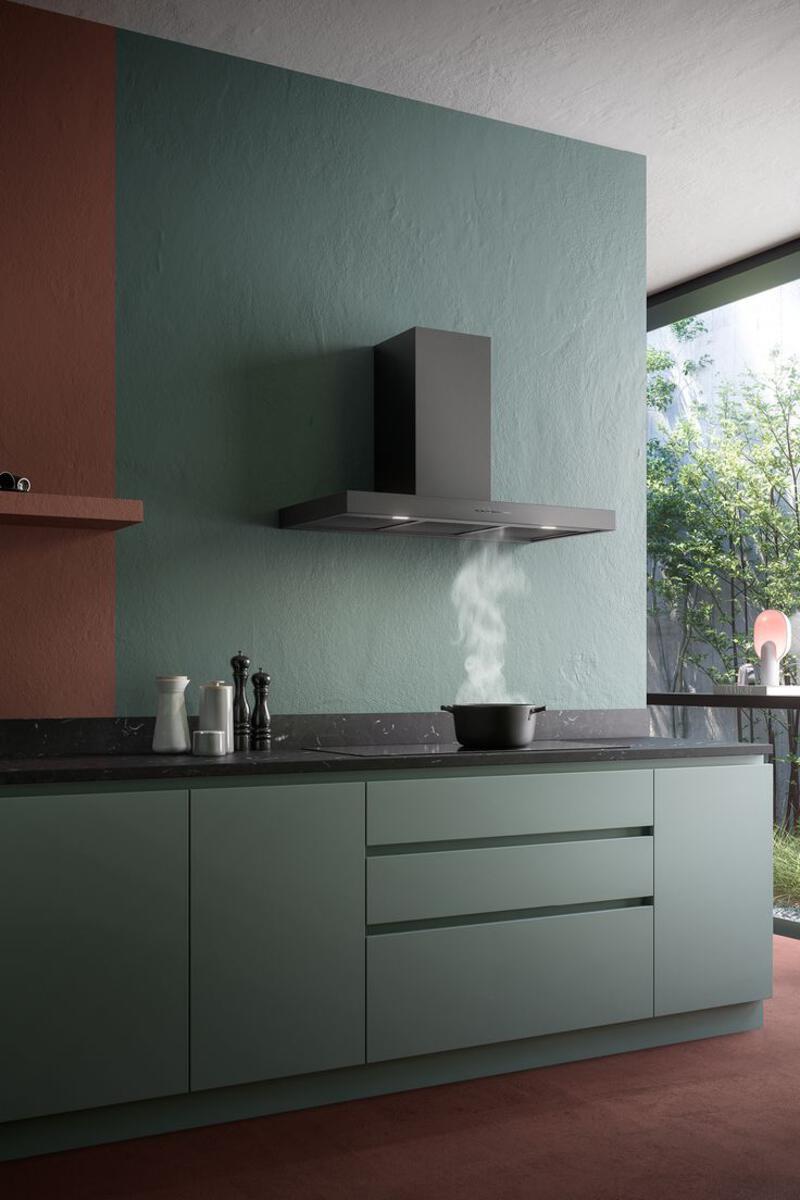 This may contain: a kitchen with green cabinets and brown flooring next to an open window that looks out onto the outdoors