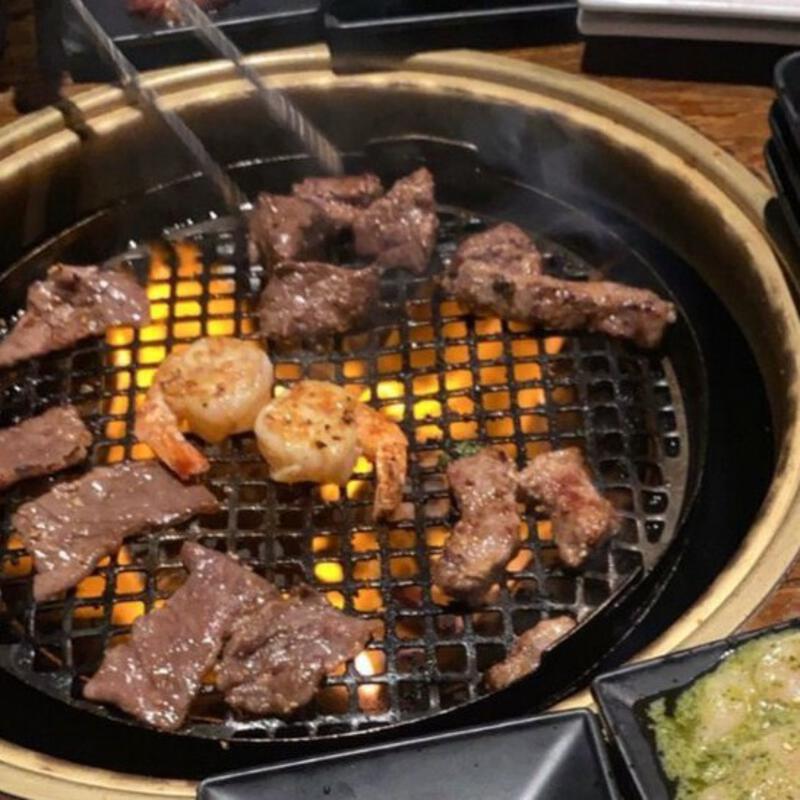 This may contain: several different types of food are being cooked on the grill