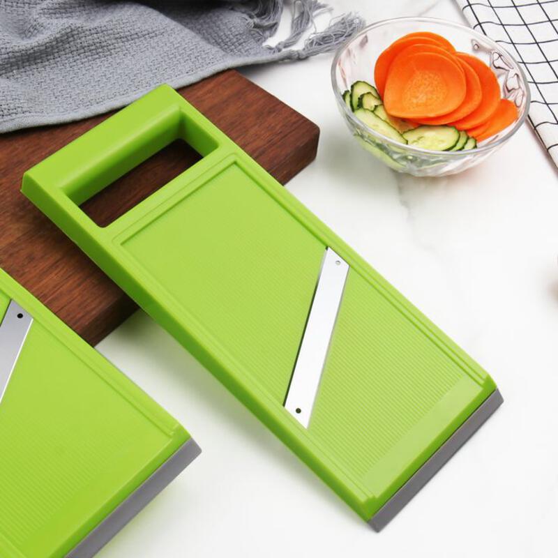 This may contain: two green cutting boards sitting on top of a counter next to a bowl of vegetables