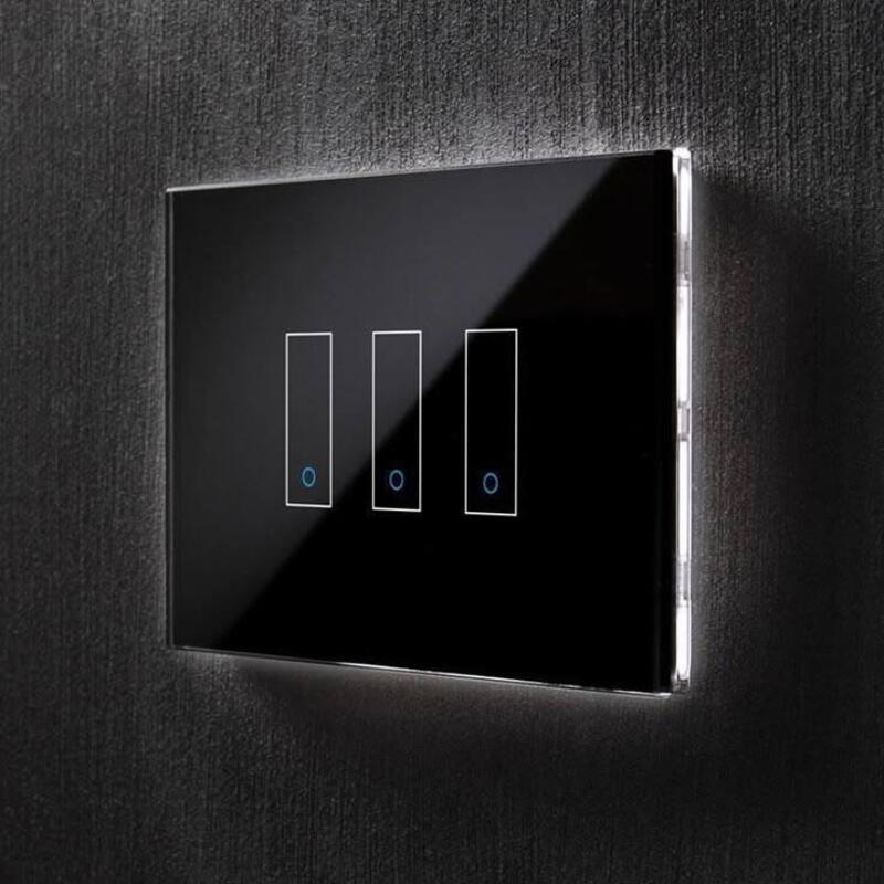 This may contain: a black light switch on the wall with three blue lights in between two white ones