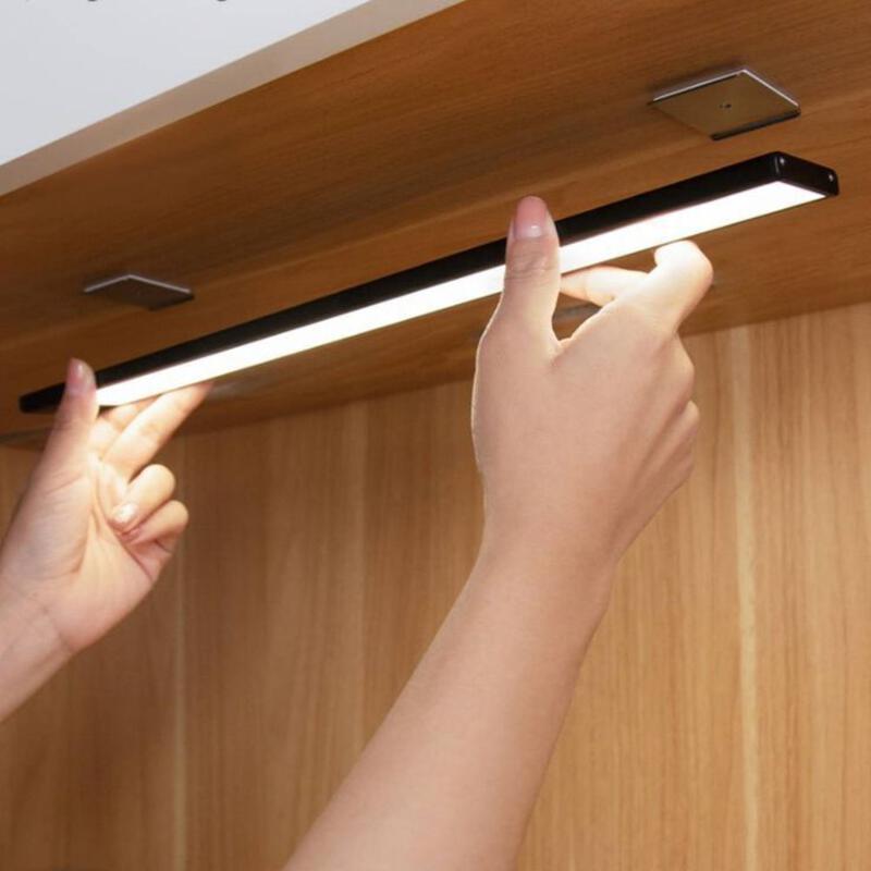 This may contain: two hands are reaching for something on the ceiling