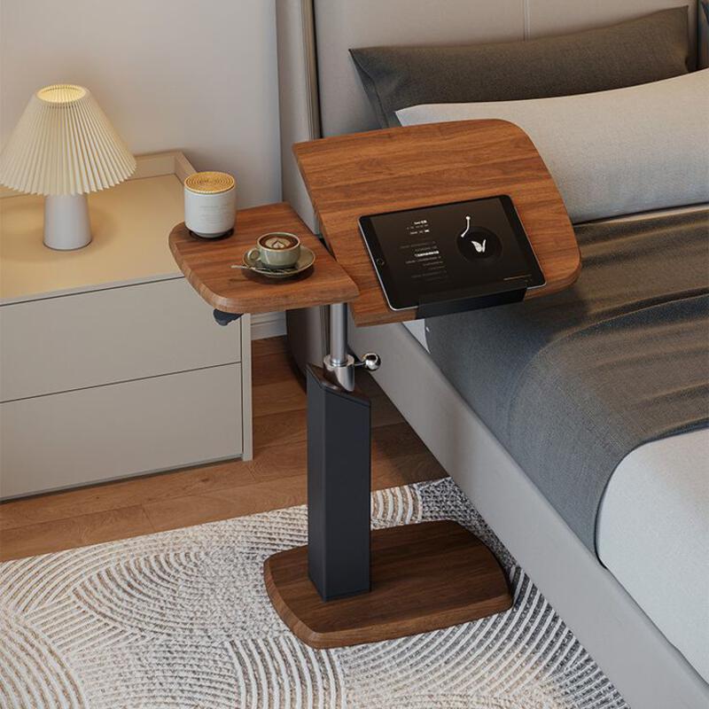 This may contain: a bed with a night stand on top of it