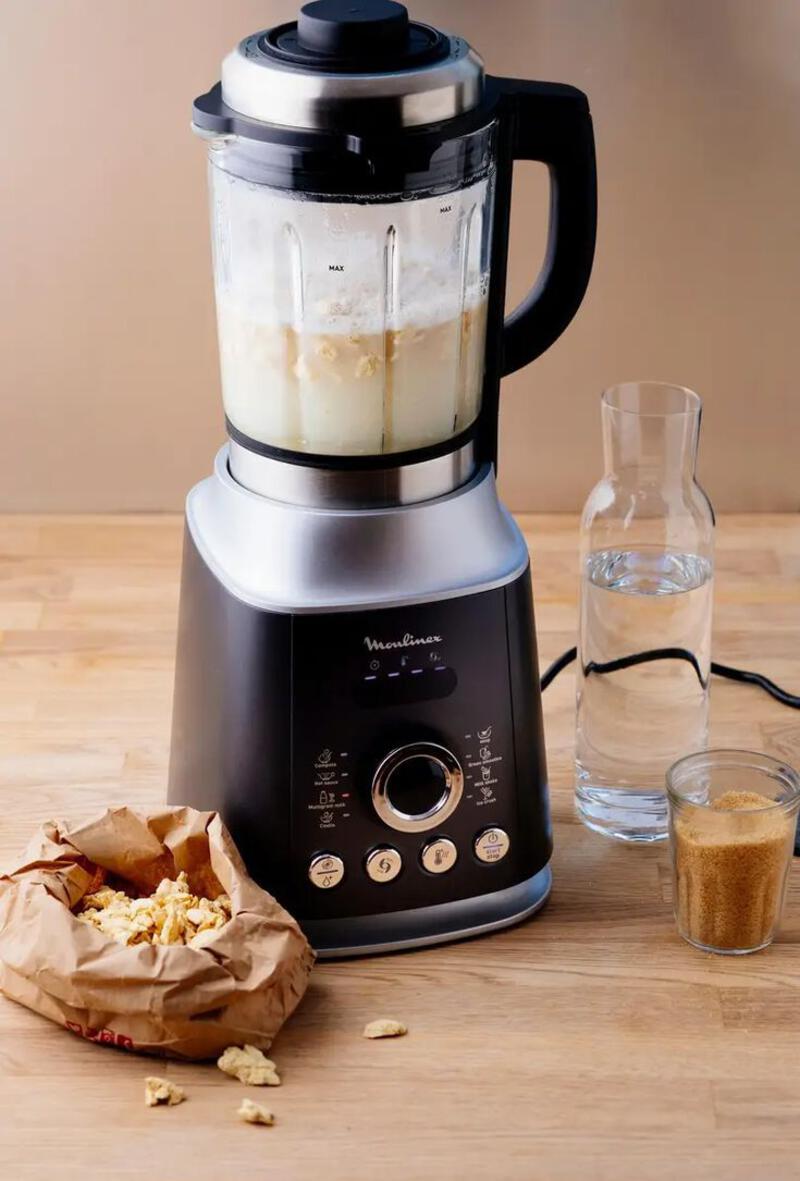 This may contain: a blender sitting on top of a wooden table